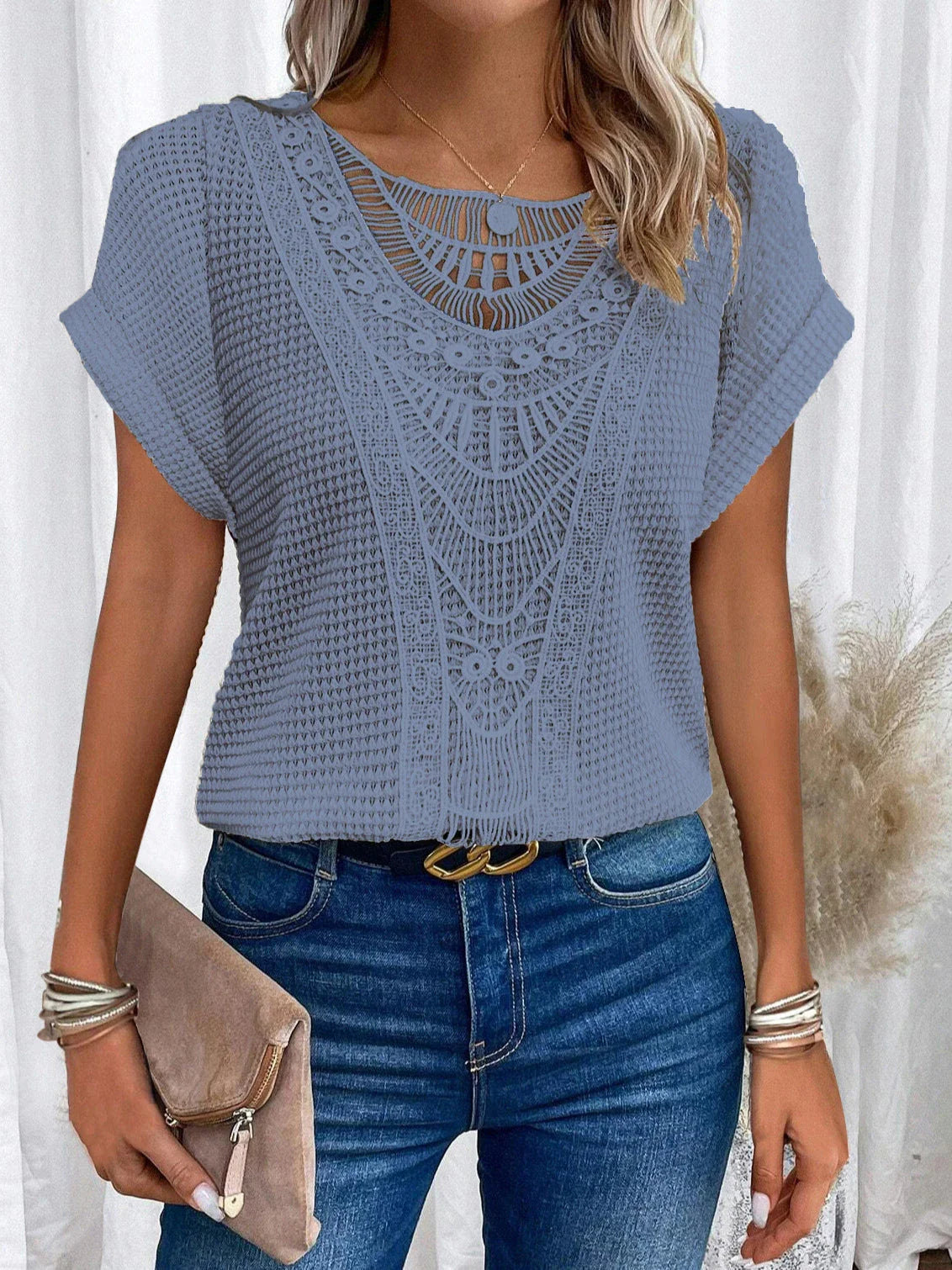 Women's short-sleeve tee in various colors, featuring a unique hollow-out design and soft, comfortable polyester fabric