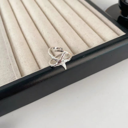Adjustable three-dimensional jasmine flower ring in zinc alloy with open mouth design and electroplated finish.