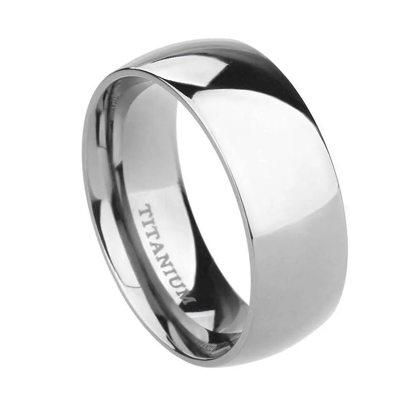 Silver titanium steel unisex ring with grinding texture on finger, showing different band width options.