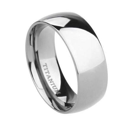 Silver titanium steel unisex ring with grinding texture on finger, showing different band width options.