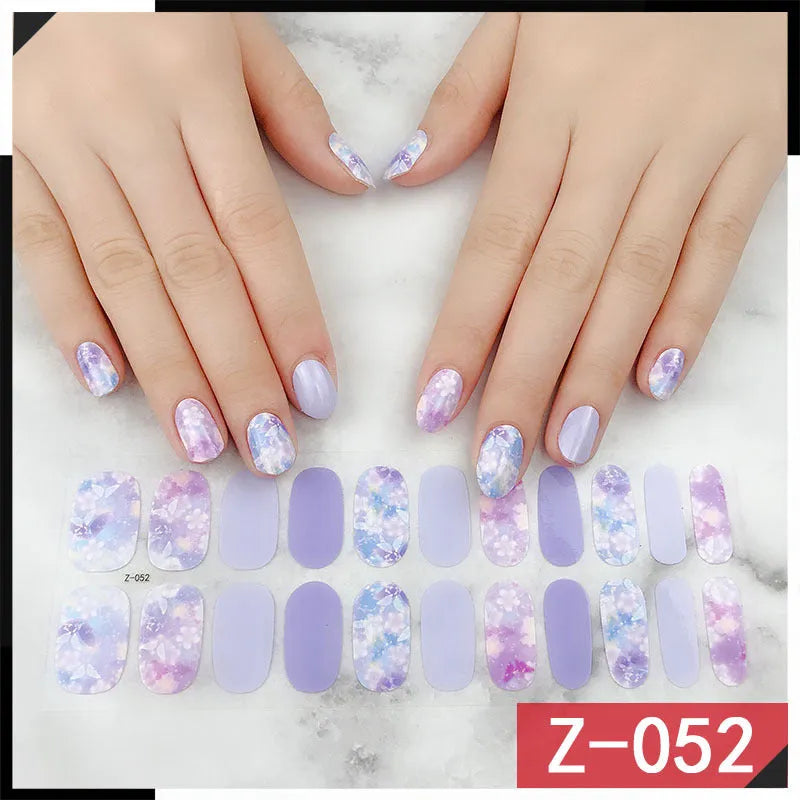 Korean nail stickers sheet showing cartoon, flower, and strawberry patterns with a nail file.