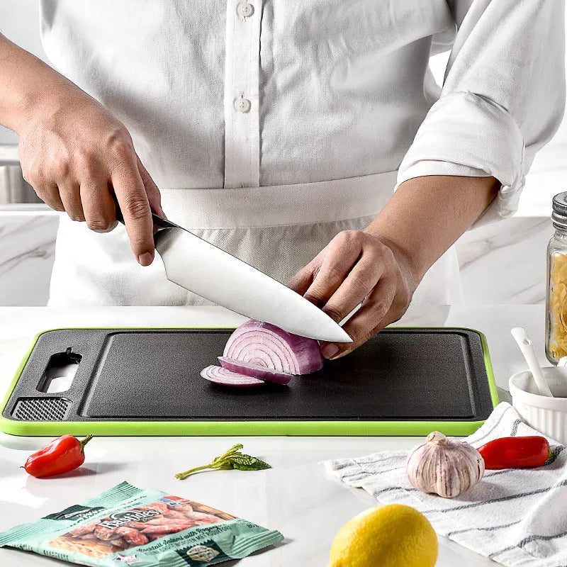 Double-sided aluminium chopping board with integrated thawing plate function, kitchen grinding surface and knife sharpener attachment in modern minimalist square design
