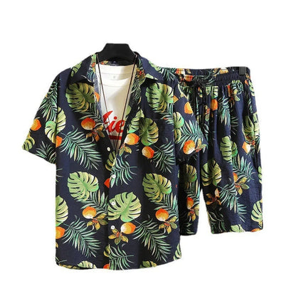 Man wearing a digitally printed short sleeve casual suit set with matching trousers.