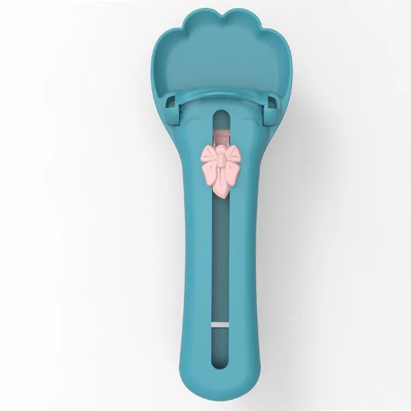 Green and pink pet food scoop and squeezer dispenser for cats and dogs.