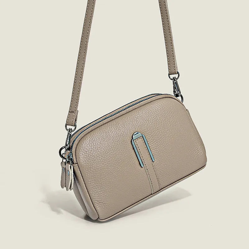 Minimalist top-grain leather crossbody bag in horizontal square shape with inner pockets, available in five colours