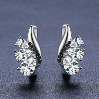 Elegant wing-shaped earrings with drop-shaped zircon stones, crafted with copper for a sophisticated and fashionable look