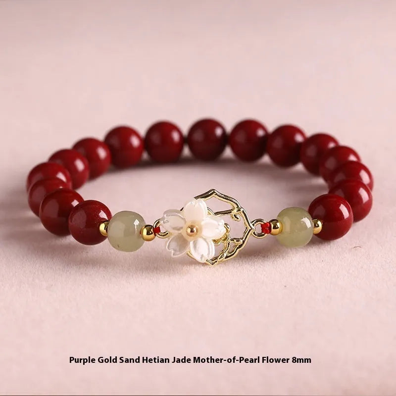 Handcrafted Hetian Jade New Chinese style bracelet in cinnabar with white butterfly, lotus and bells of Ireland motifs