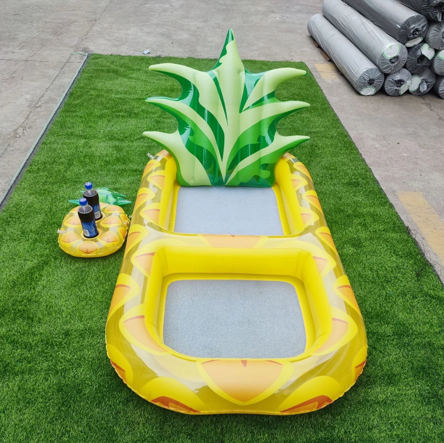 Yellow pineapple-shaped inflatable pool float with drink holder and ergonomic headrest design