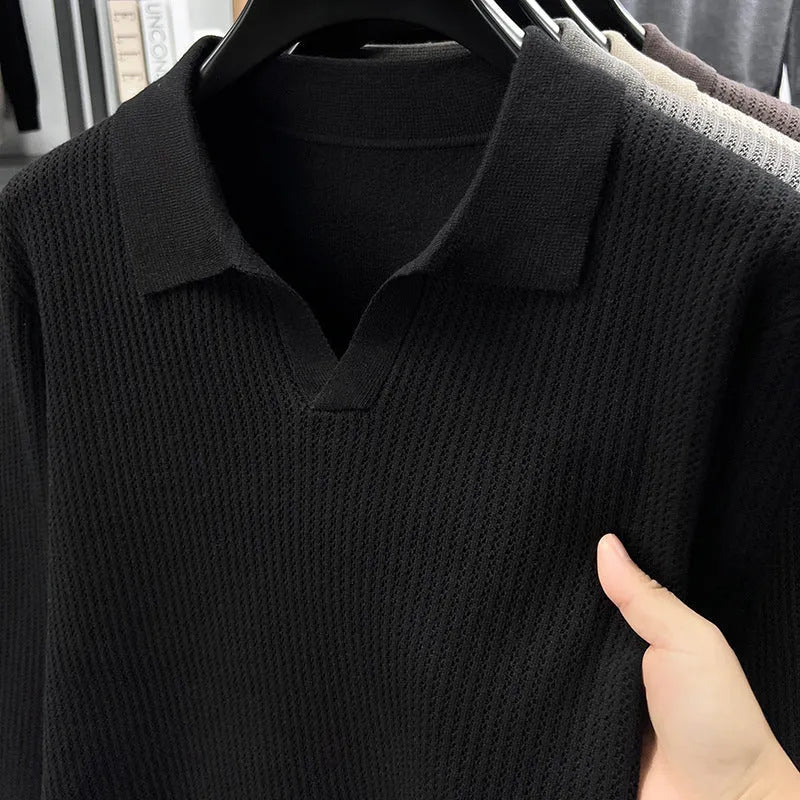 Man wearing a loose fit camel coloured pullover sweater, a casual autumn layer with a simple design.