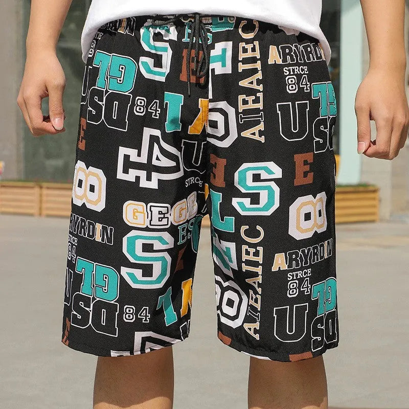 Man wearing loose-fitting striped beach pants made from quick-dry ice silk fabric.