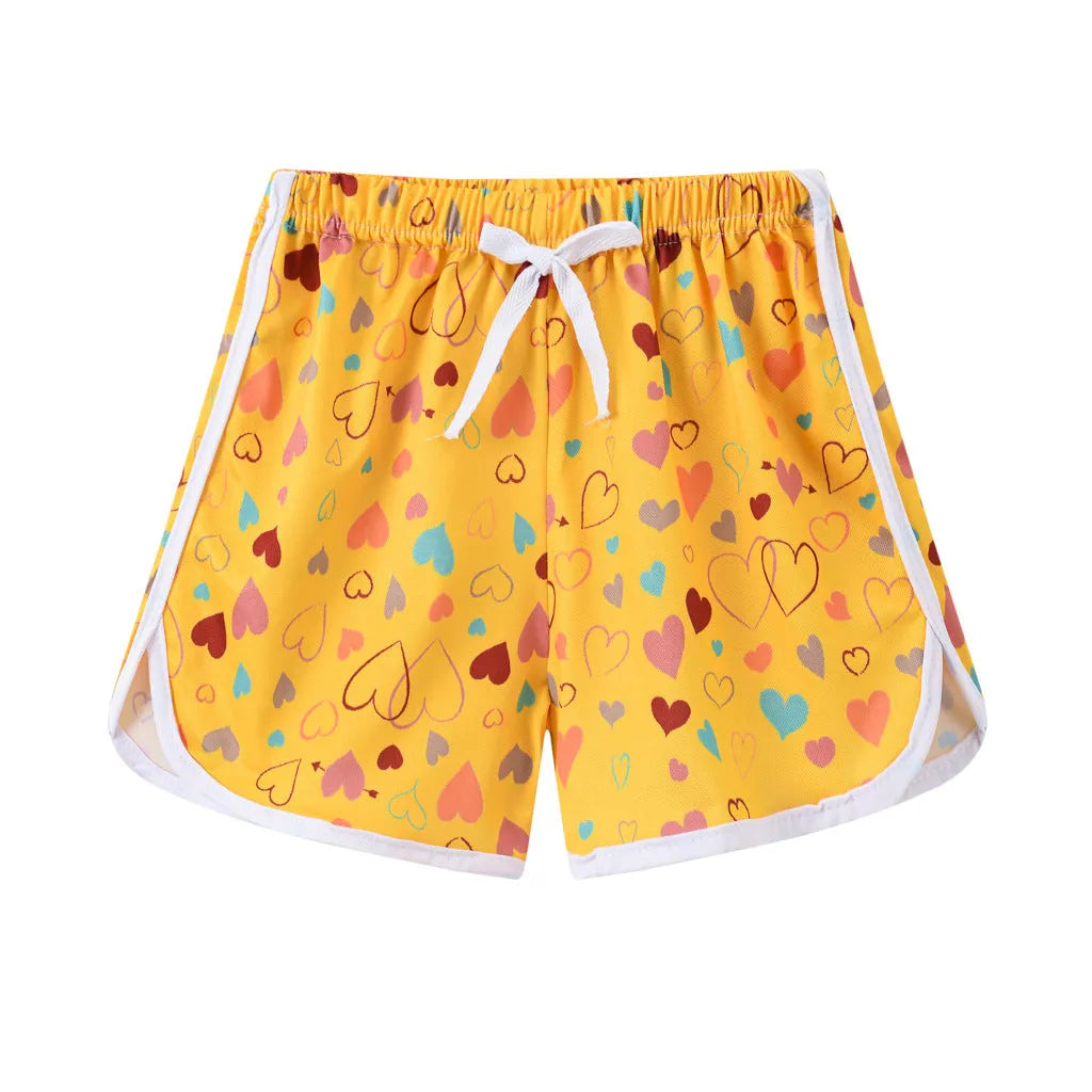 Children's polyester beach shorts in multiple colours and patterns, including leopard print and stripes, shown on size chart.