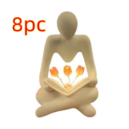 Nordic abstract thinker statue with tulip book night lamp measuring 7x6.3x11.5cm
