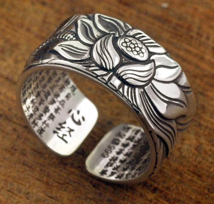 Handcrafted Thai sterling silver ring with intricate Heart Sutra engraving, promoting mental clarity and emotional balance.