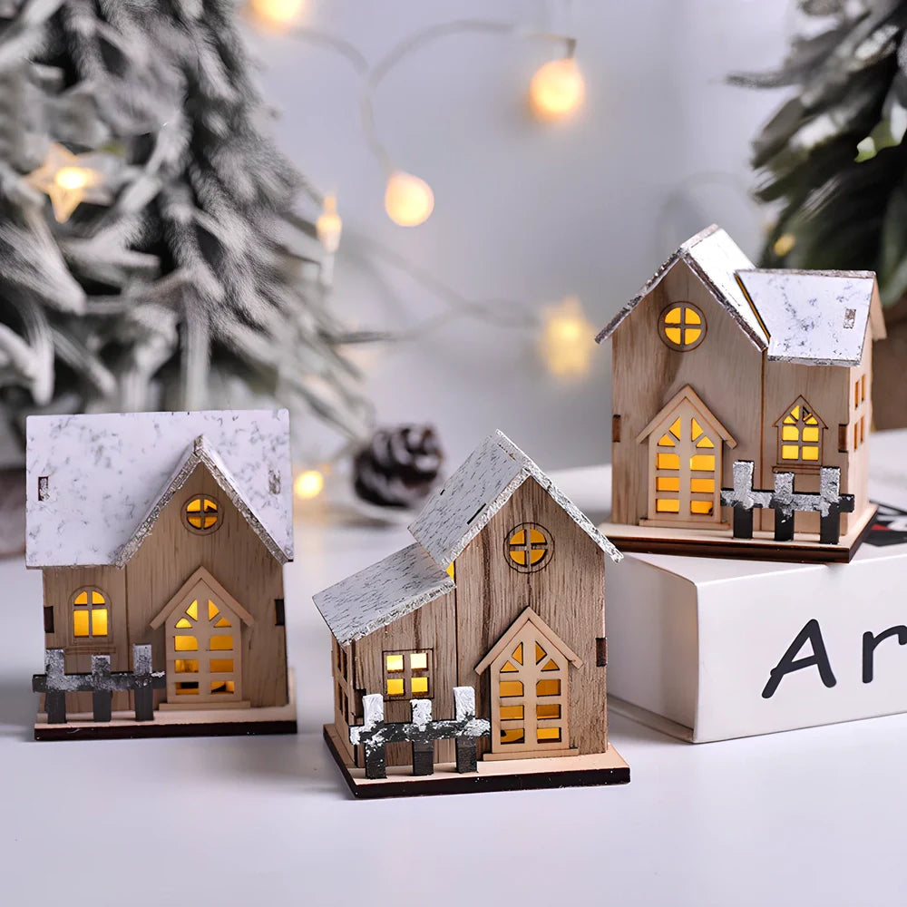 LED illuminated wooden Christmas cabin measuring 8cm by 7cm by 9.5cm with festive lighting