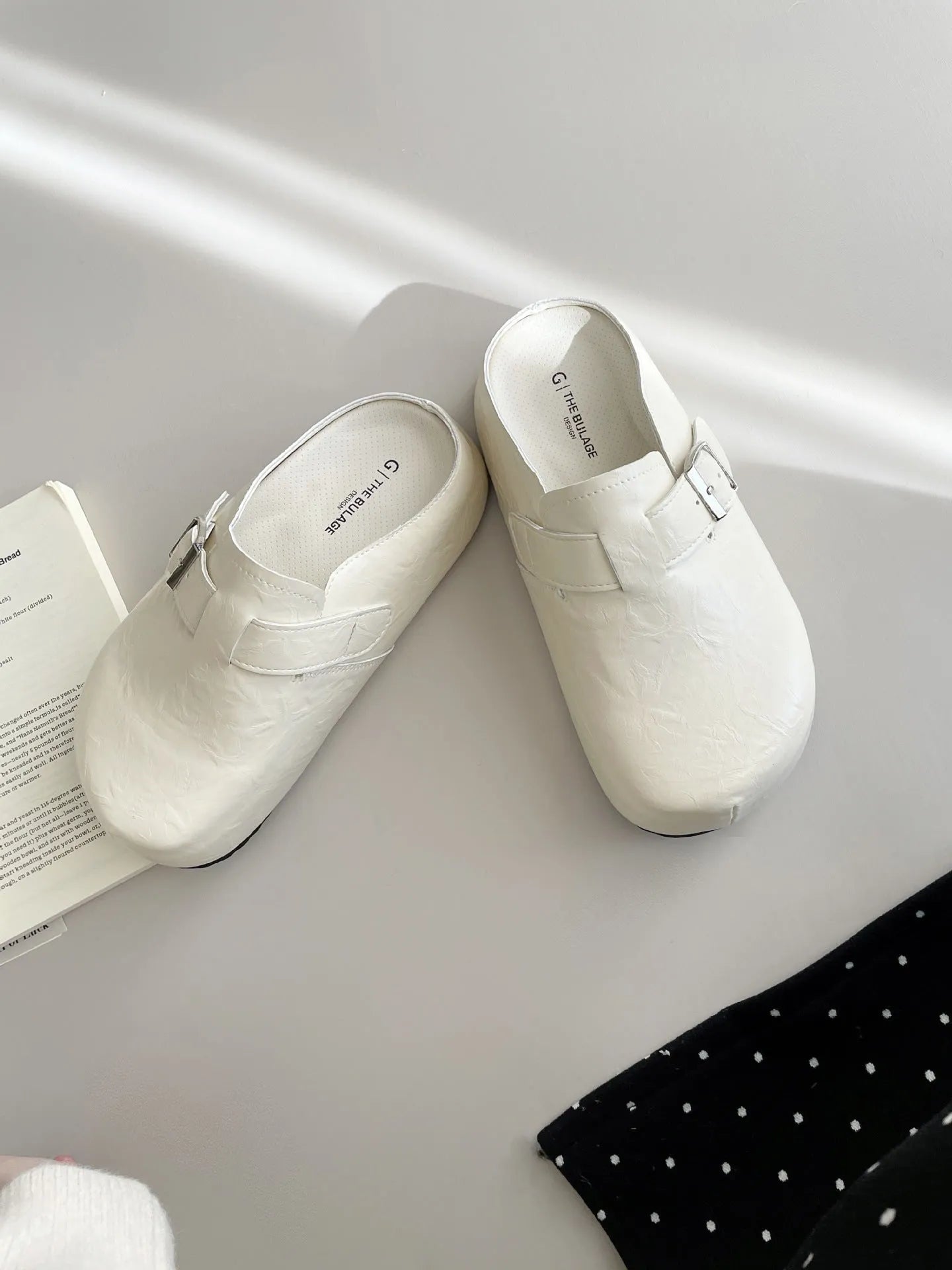 Flat buckle casual sneakers in beige, black, silver, and yellow colours, showing round toe and PU upper.