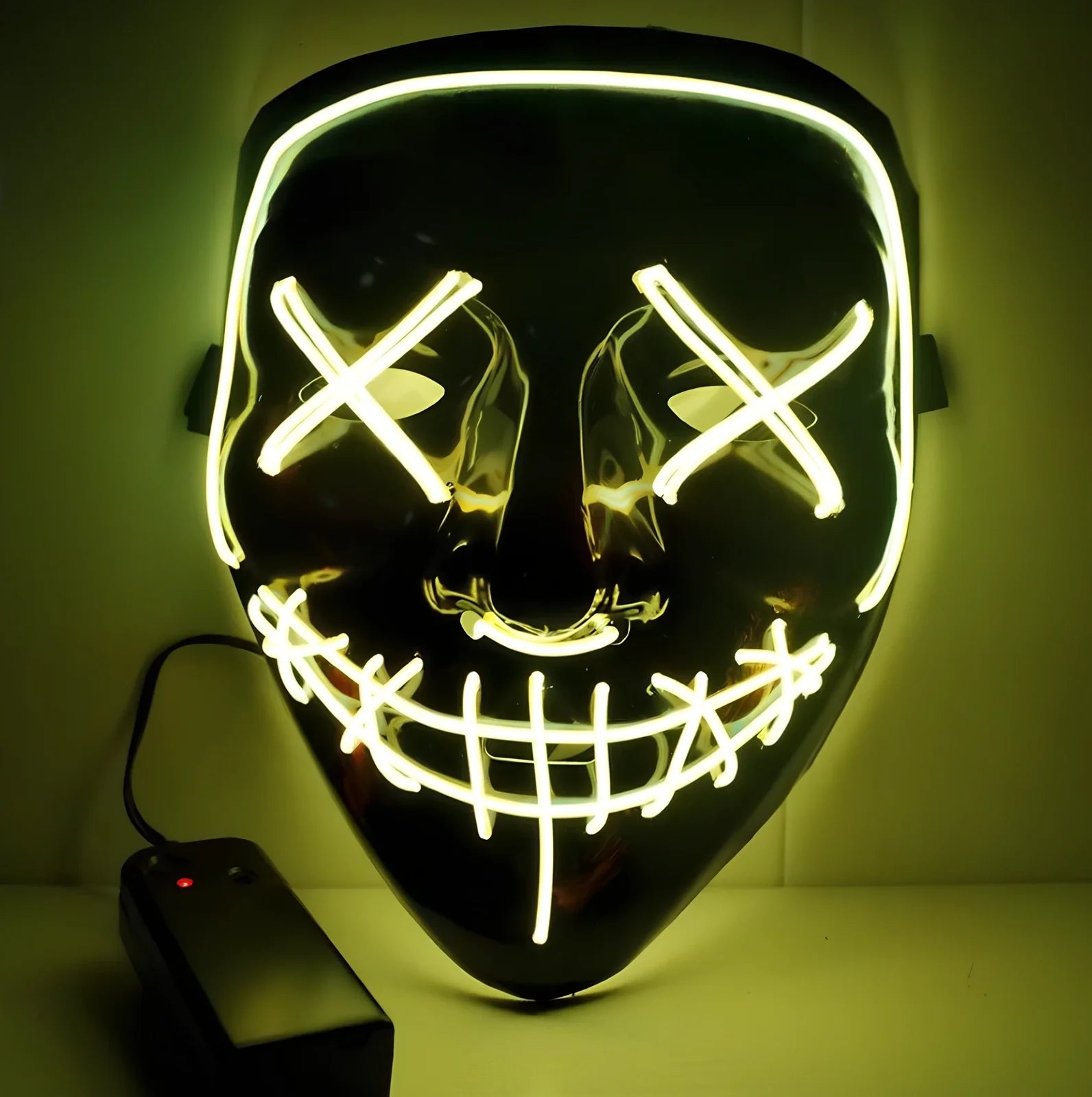 Black V-shaped electroluminescent Halloween mask glowing with uniform illumination, showing folding capability and plastic construction
