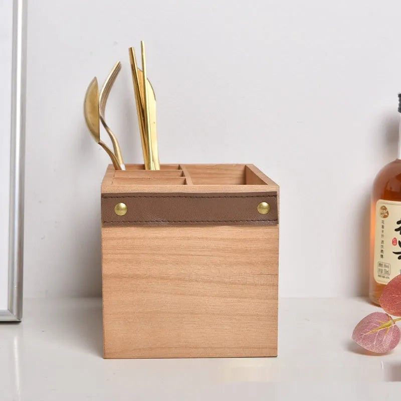 Solid wood kitchen storage box with internal grid divider for organising cutlery and chopsticks.
