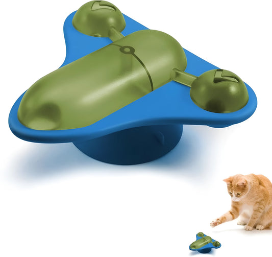 Blue interactive pet puzzle toy with bell, catnip, and snack cabin on a floor.