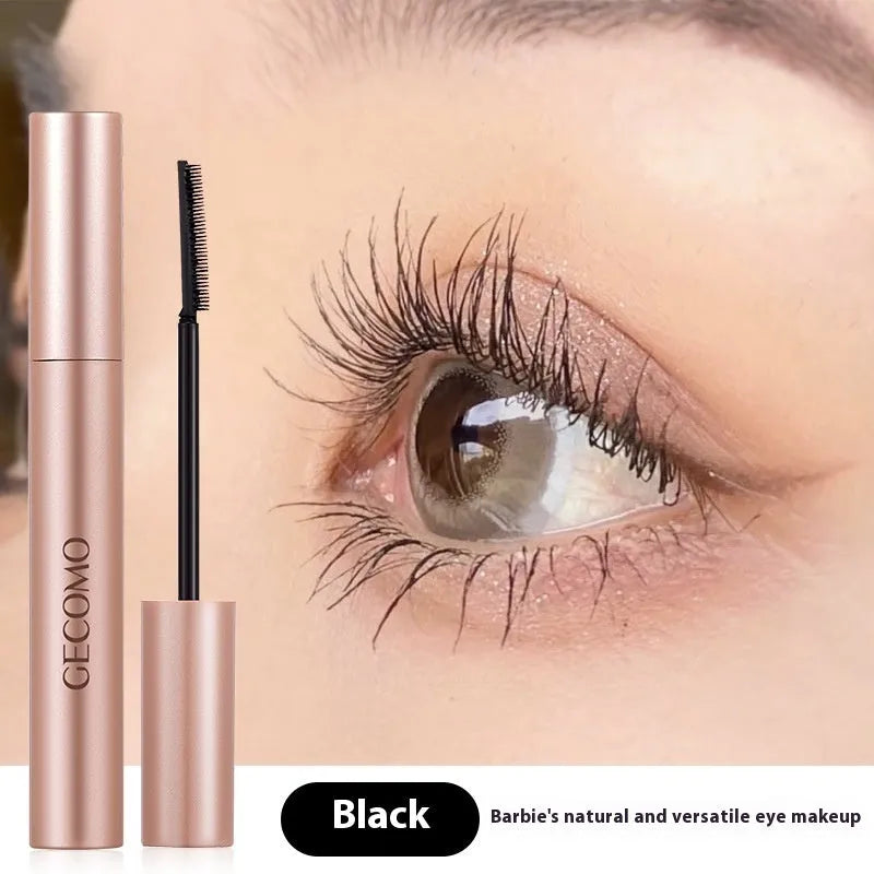 Black mascara tube for curly long lashes, 14cm tall with 8g content.