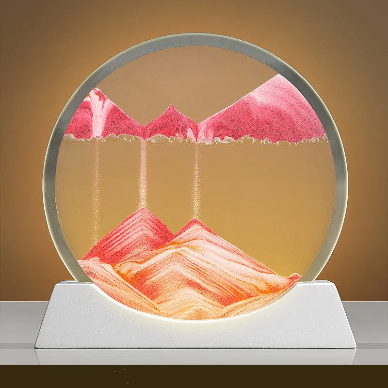 A rotary abstract night lamp with coloured sand falling inside clear glass, showing blue variant.