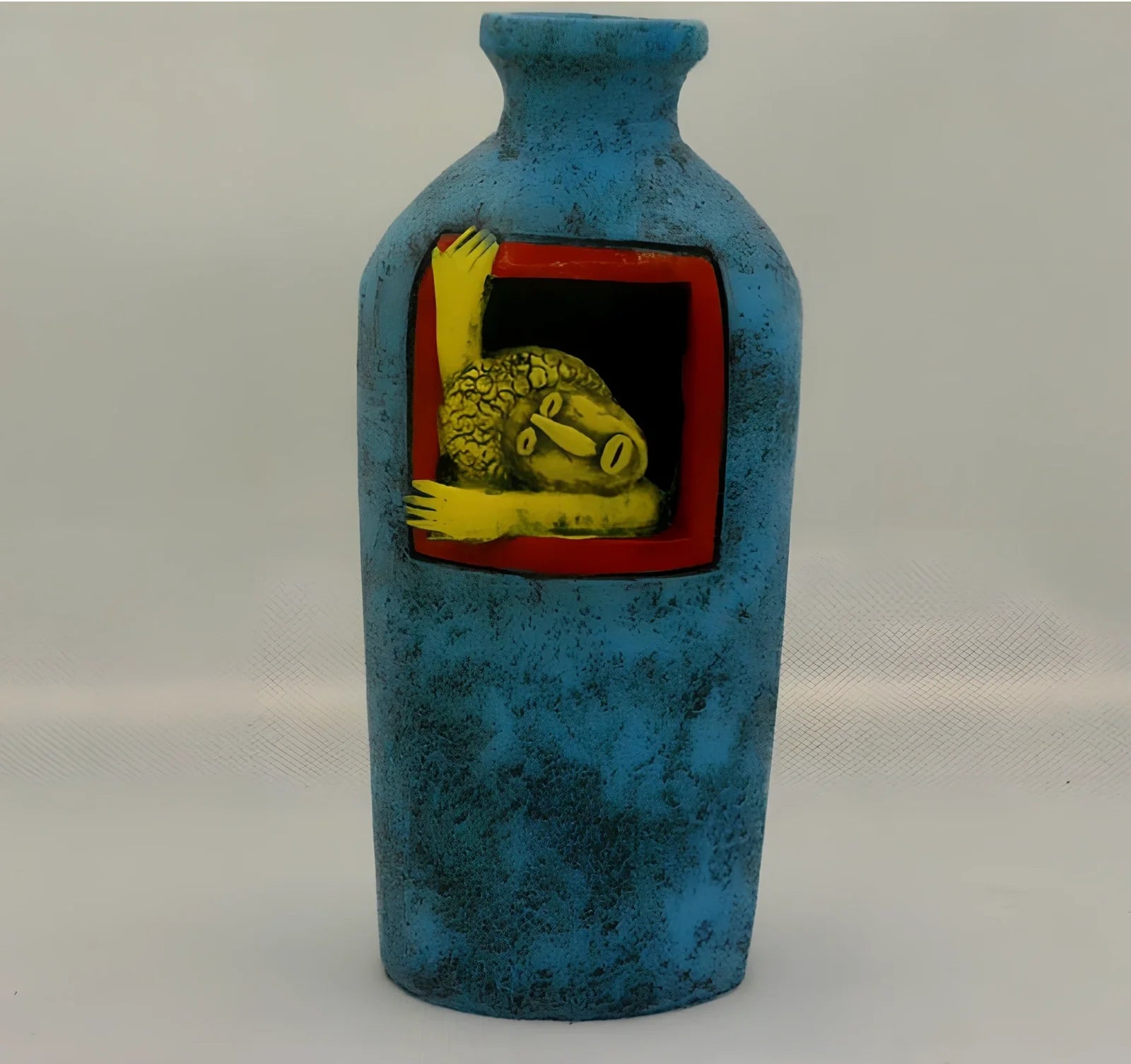 Blue hand-painted abstract resin wall vase measuring 18cm tall with pendant hanging form