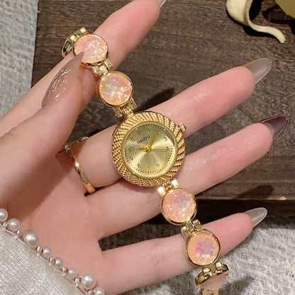 Women's quartz watch with 25mm round dial in milky white, on a zinc alloy case.