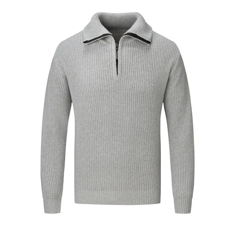 A man wearing a solid-colour slim-fit loose pullover sweater in a neutral colour.