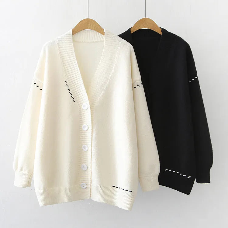 Women's knitted cardigan top coat in black or white, loose fit with long sleeves, made from 100% polyester