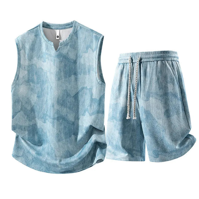 Man's casual sleeveless vest and shorts suit in a quick-drying fabric, shown in light denim blue.
