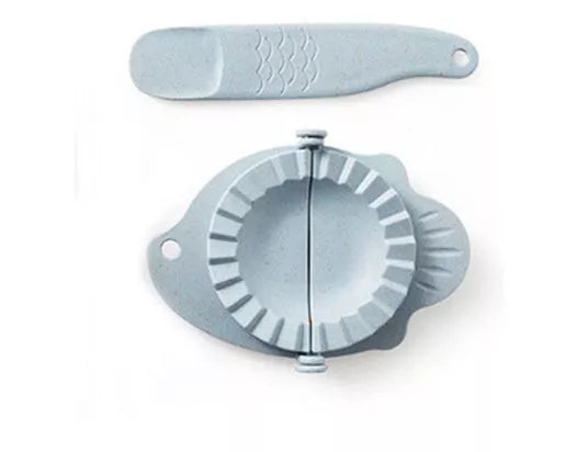 Plastic dumpling maker device in blue, green, and white for quick, uniform dumplings