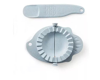 Plastic dumpling maker device in blue, green, and white for quick, uniform dumplings