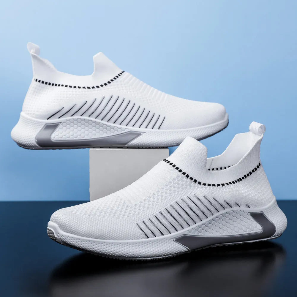 Men's black and white striped mesh slip-on sneakers with lace-up front.