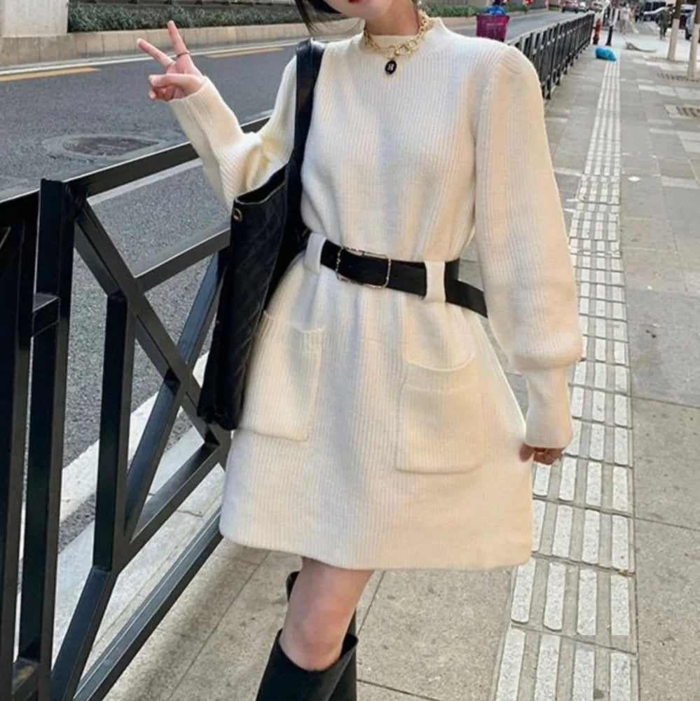 Women's long sleeve loose knitted dress in beige with black belt, showing high waist design and free size fit