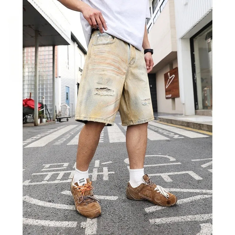 Men's light blue ripped denim shorts with straight-leg style and mid-waist design