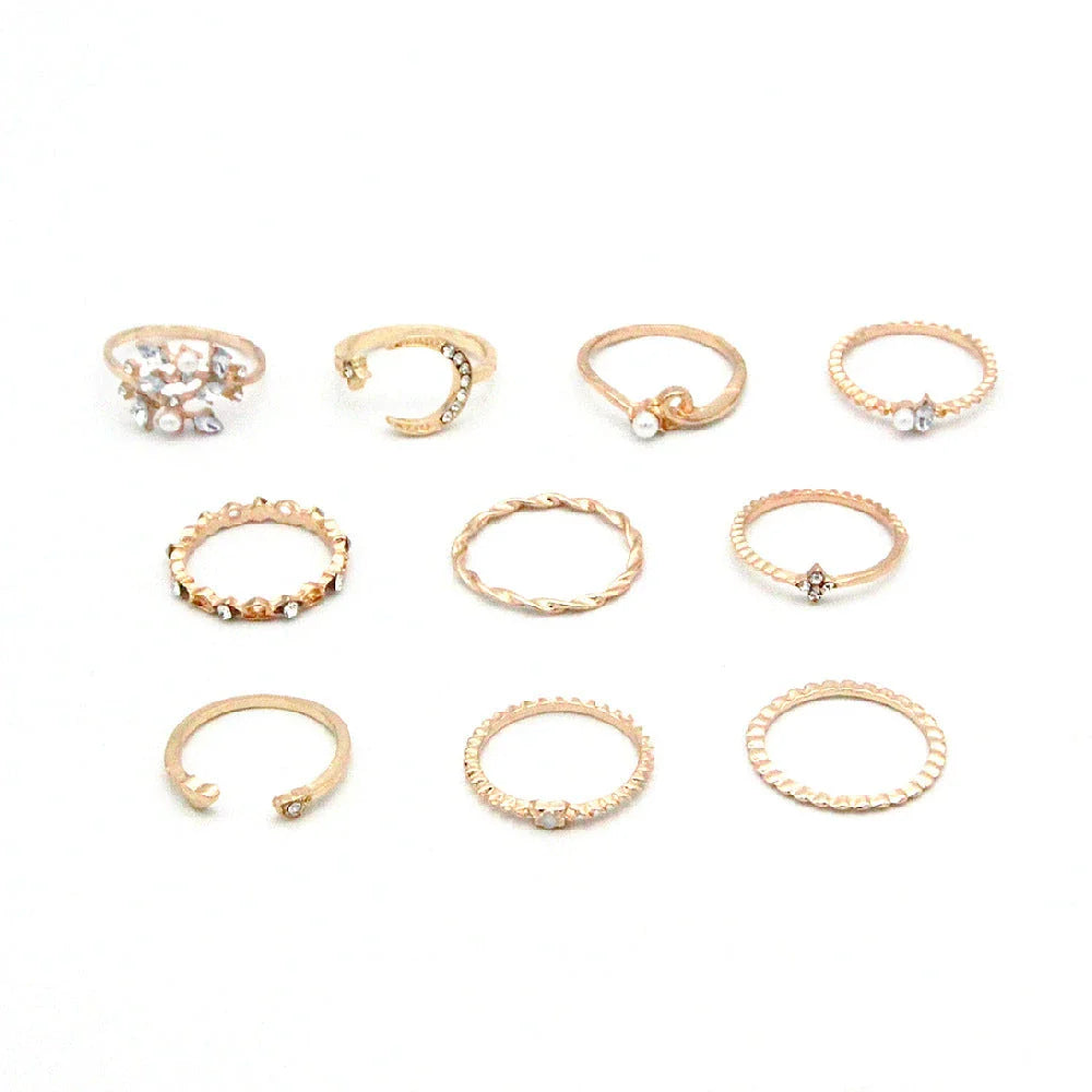 Enchanting gold-plated celestial-themed rings featuring stars, moons, and pearls