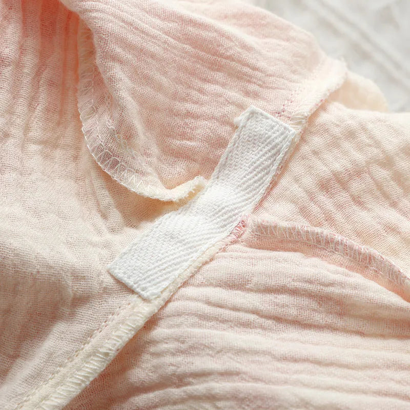 Women's pink pure cotton gauze long sleeve top and matching trousers lounge suit set.