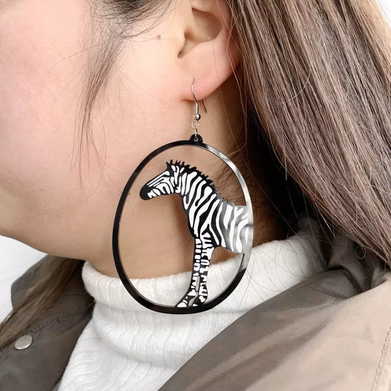 Black acrylic dangle earrings featuring unique animal and zodiac designs, lightweight and stylish.
