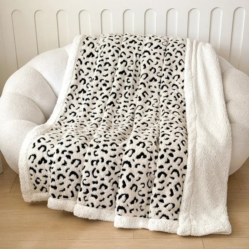Double-layer cationic leopard jacquard taffeta blanket showing raised animal print pattern in available colour options