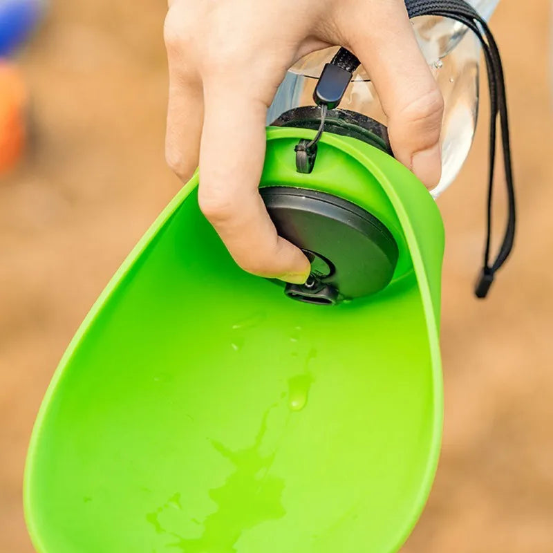 Portable pet water bottle with drinking bowl in blue, showing 680ml capacity and key lock mechanism