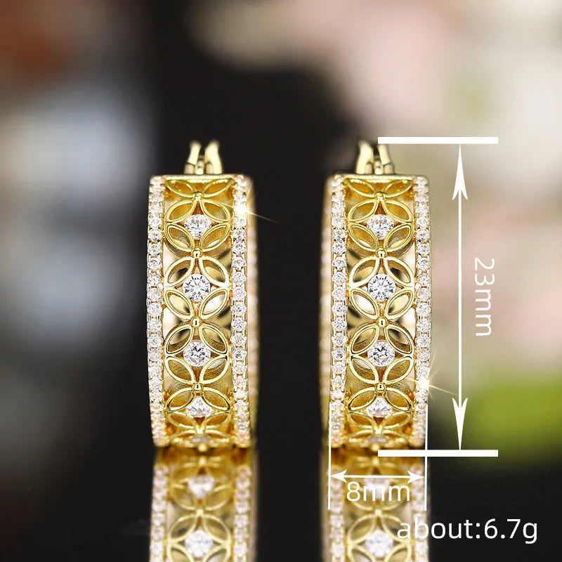 Golden copper ear clip jewellery featuring a geometric horse eye design with flower and butterfly details.