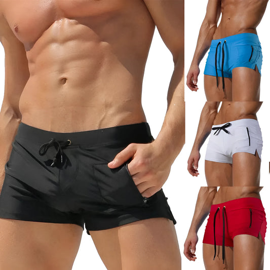 Men's black high-waisted swimming trunks with a white lace-up front closure, laid flat.