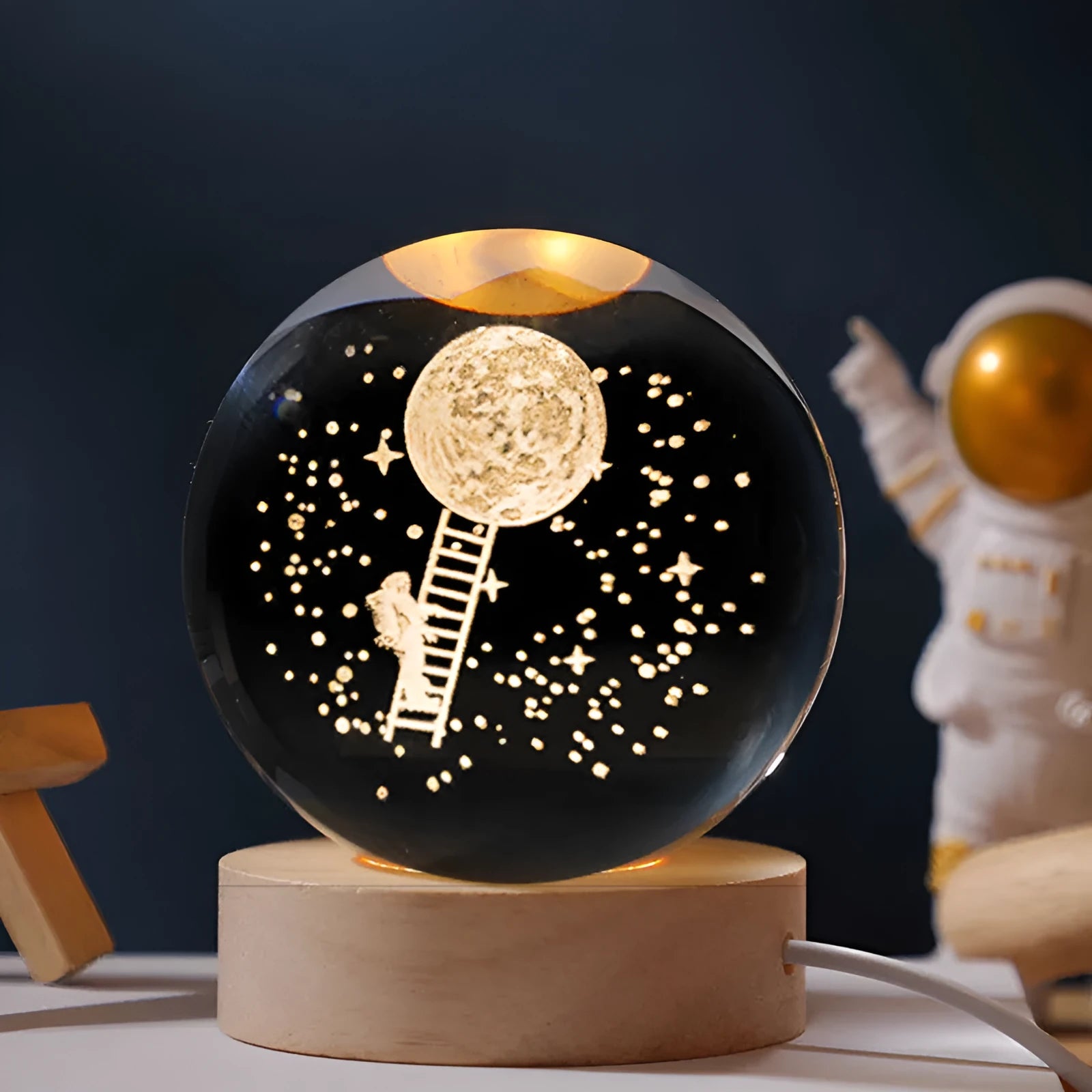 USB-powered luminous crystal ball decoration with starry sky design on a round wooden base.