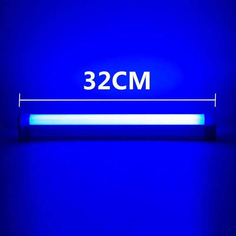 Blue rechargeable LED light tube with USB plug and push-button switch on a dark surface
