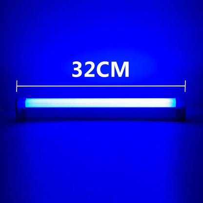 Blue rechargeable LED light tube with USB plug and push-button switch on a dark surface