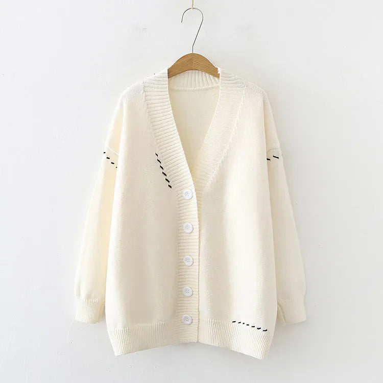 Women's knitted cardigan top coat in black or white, loose fit with long sleeves, made from 100% polyester