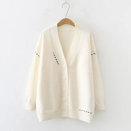 Women's knitted cardigan top coat in black or white, loose fit with long sleeves, made from 100% polyester