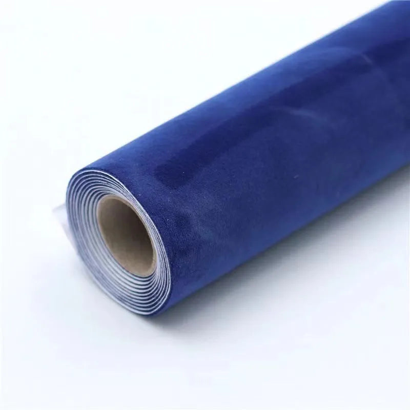 Rolls of self-adhesive leather suede in multiple colours showing texture and adhesive backing.