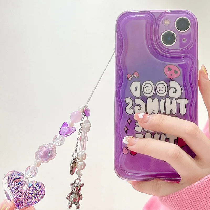 Purple graffiti design iPhone case with a silver love pendant chain attached