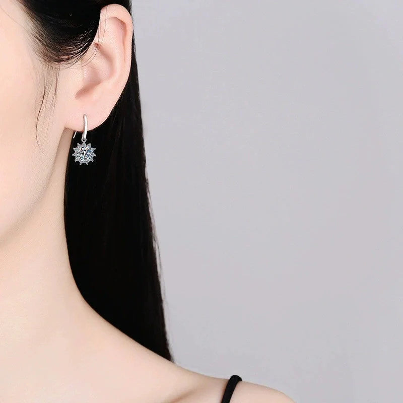 Elegant sunflower-inspired ear cuffs with a gleaming white gold finish, offering affordable luxury and sophisticated style.