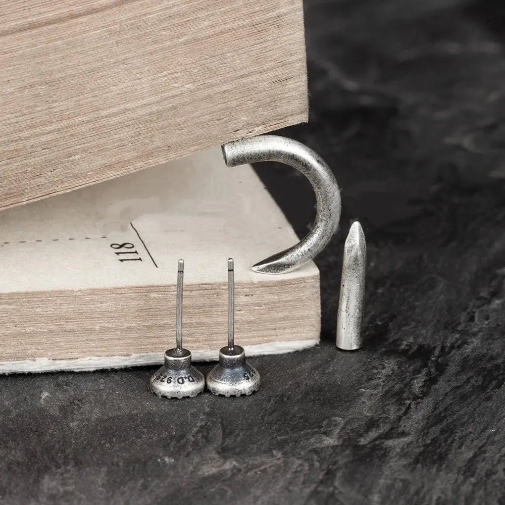 S925 sterling silver single stud earring featuring a straight or curved nail punk design.